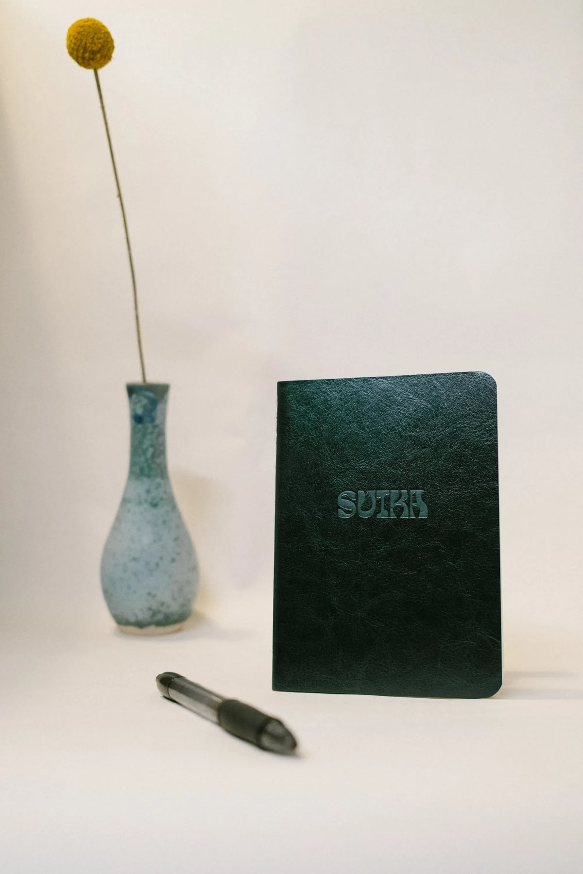 SUIKA Passport Notebook, green cover with embossed SUIKA logo